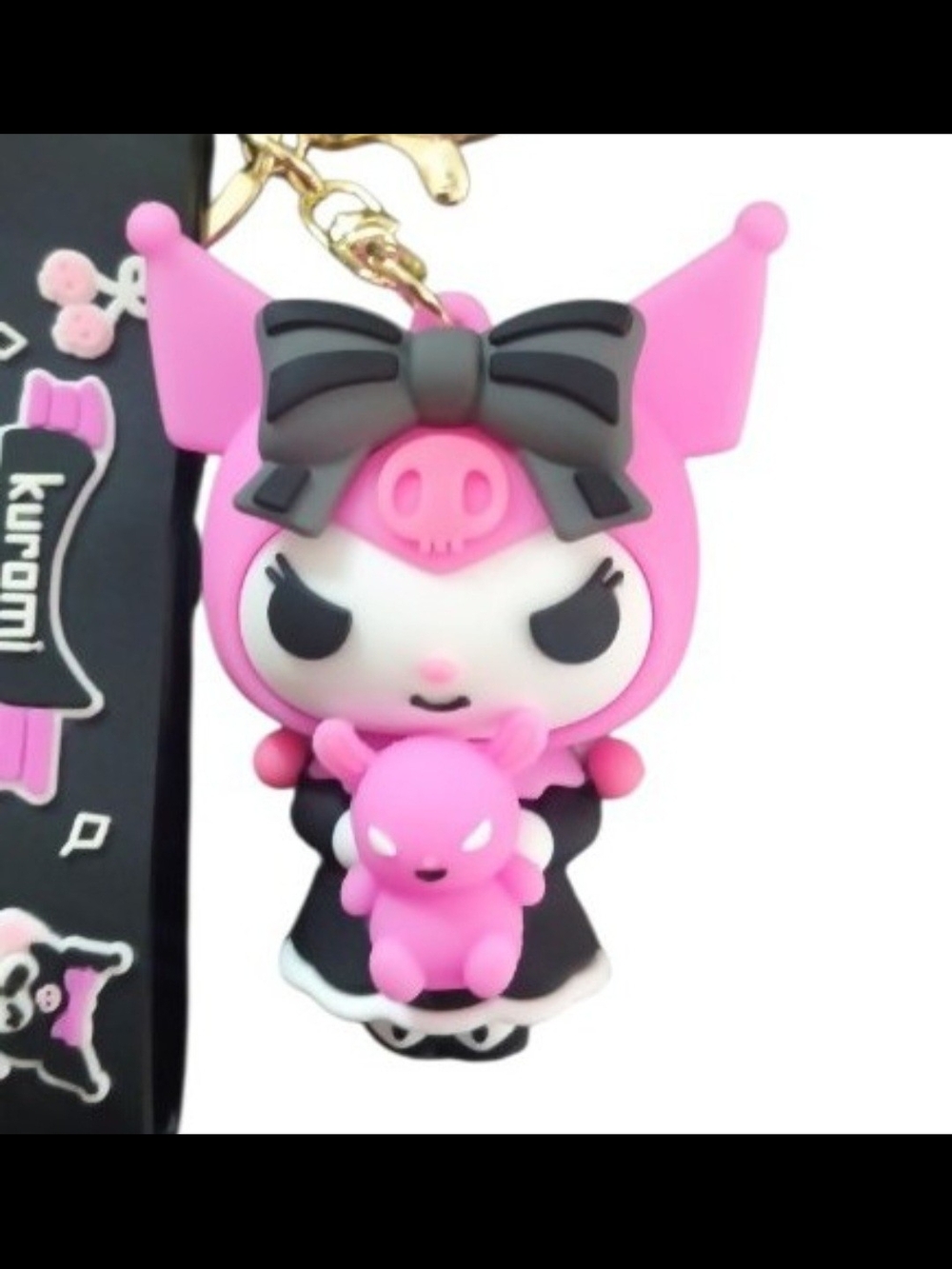 Sanrio Kuromi keychain features Kuromi holding a small pink teddy bear
